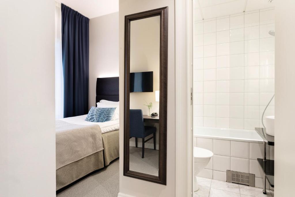 Postel nebo postele na pokoji v ubytování Elite Grand Hotel Norrköping
