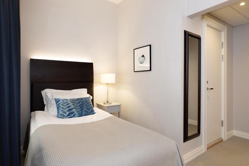 Postel nebo postele na pokoji v ubytování Elite Grand Hotel Norrköping