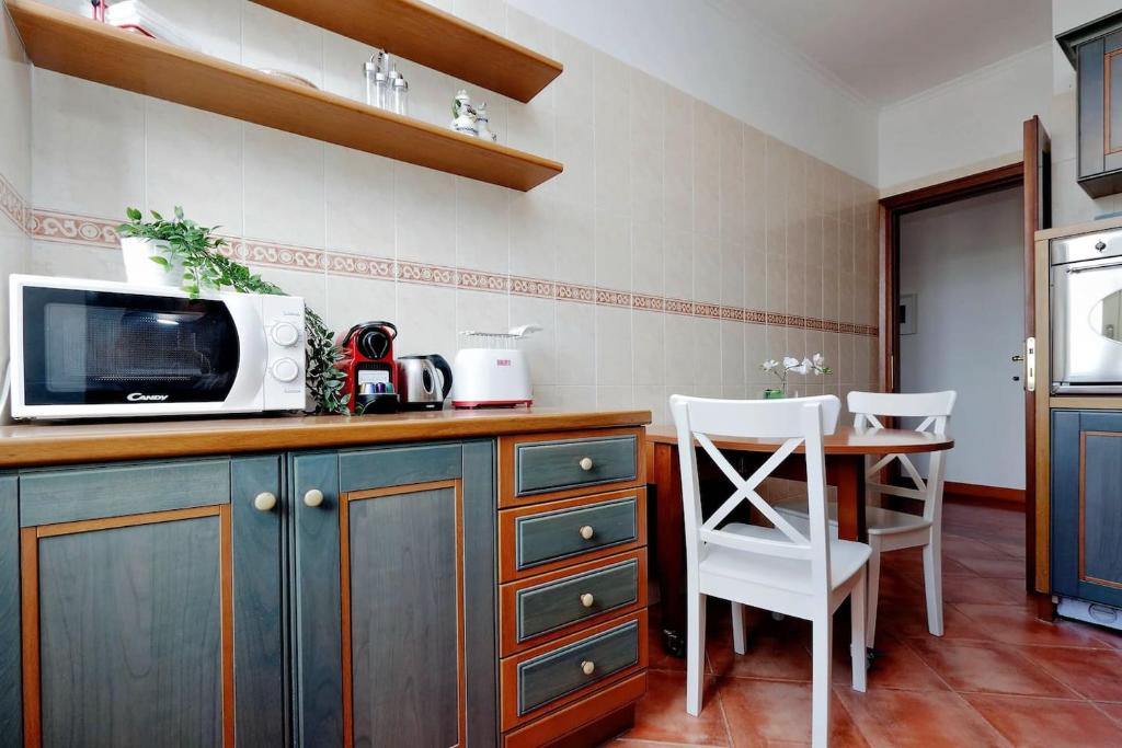 Kuchyňa alebo kuchynka v ubytovaní Colosseo Sunset Apartment