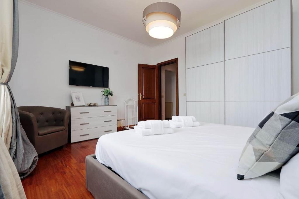 Posteľ alebo postele v izbe v ubytovaní Colosseo Sunset Apartment