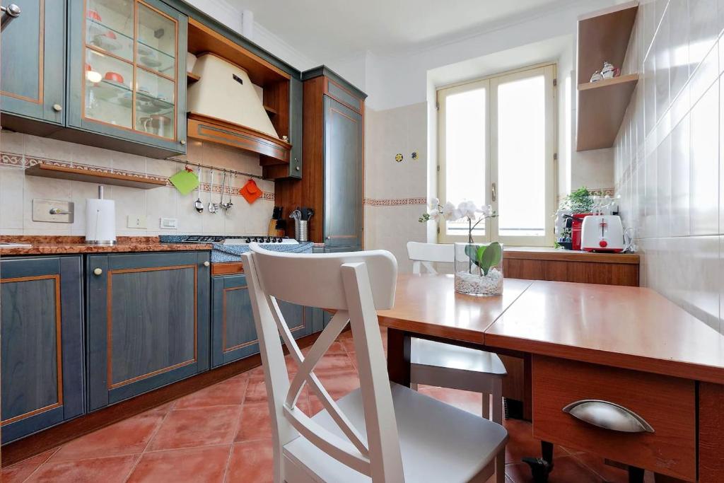 Kuchyňa alebo kuchynka v ubytovaní Colosseo Sunset Apartment