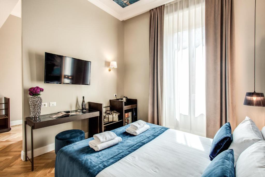 Postel nebo postele na pokoji v ubytování Hotel 55 Fifty-Five - Maison d'Art Collection