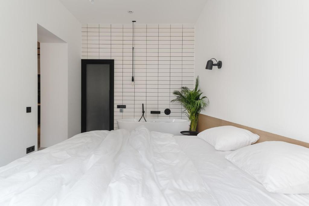 Posteľ alebo postele v izbe v ubytovaní Owntown Apart Hotel