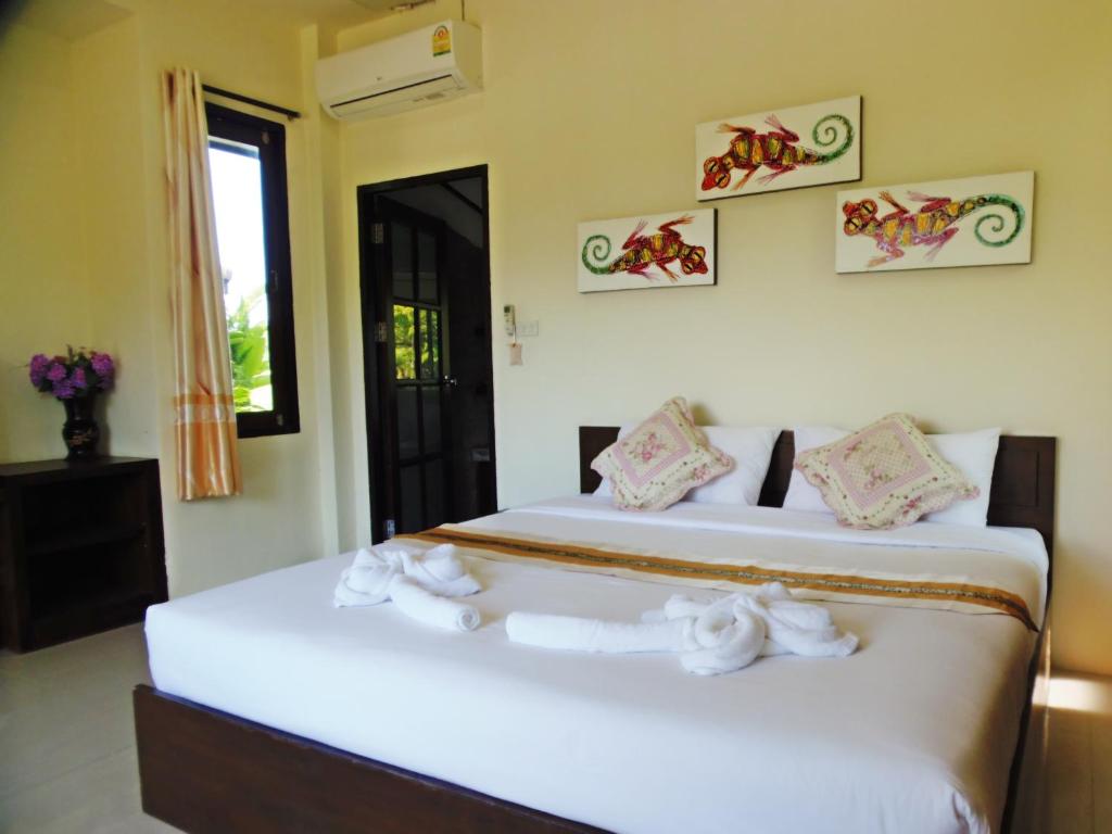 Postel nebo postele na pokoji v ubytování Pai My Guest Resort - SHA Plus