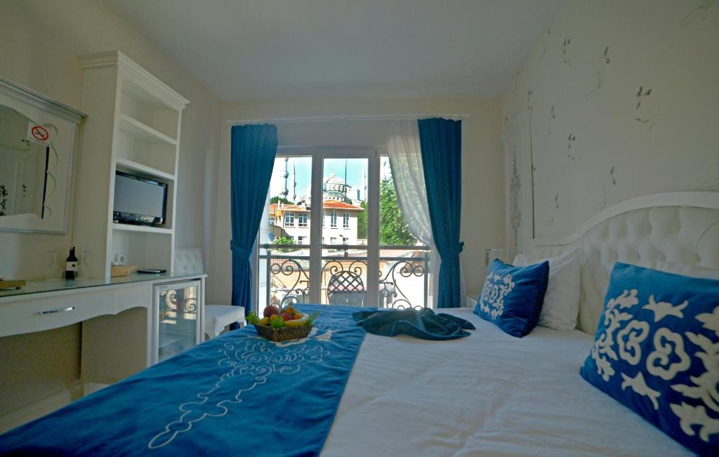 Ένα ή περισσότερα κρεβάτια σε δωμάτιο στο Sarnic Hotel & Sarnic Premier Hotel(Ottoman Mansion)