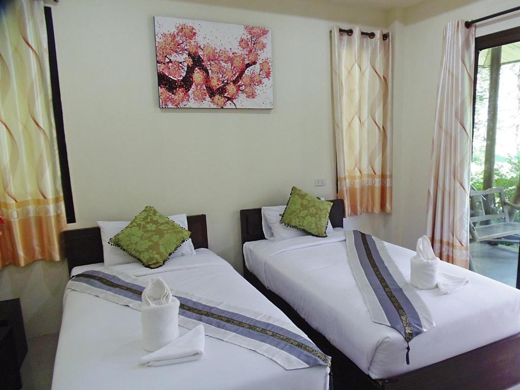 Postel nebo postele na pokoji v ubytování Pai My Guest Resort - SHA Plus
