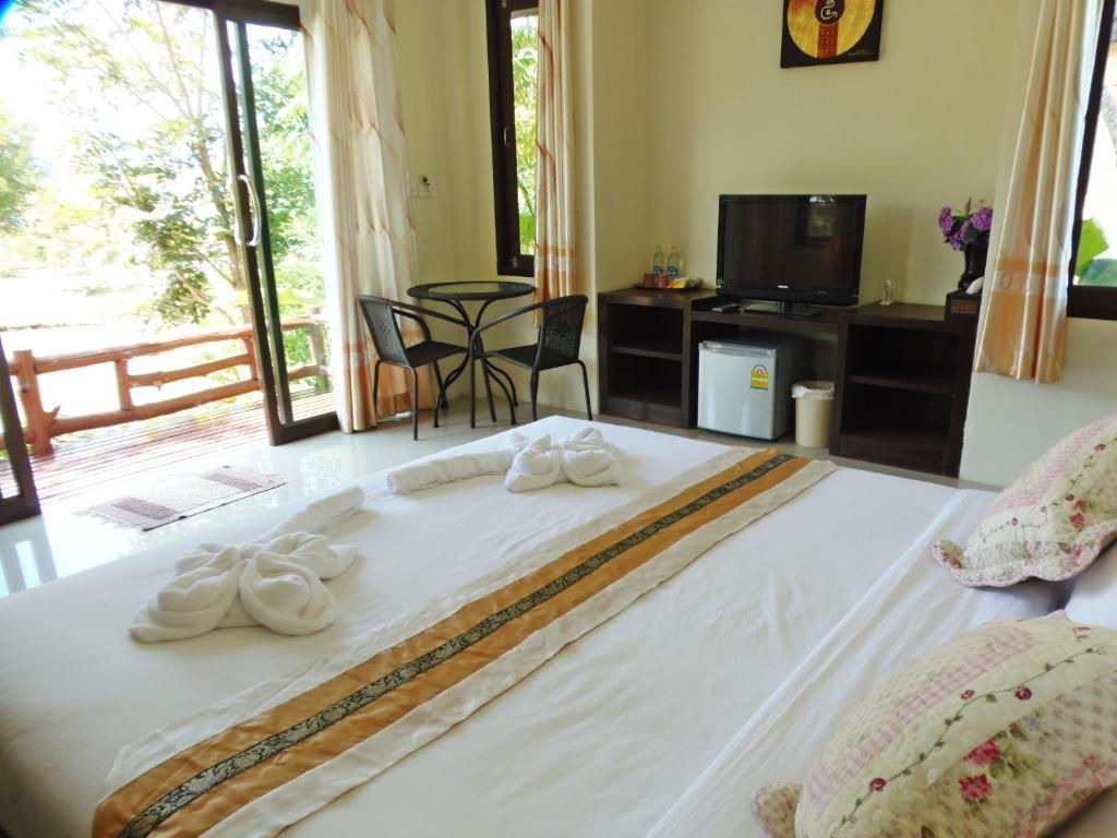 Postel nebo postele na pokoji v ubytování Pai My Guest Resort - SHA Plus
