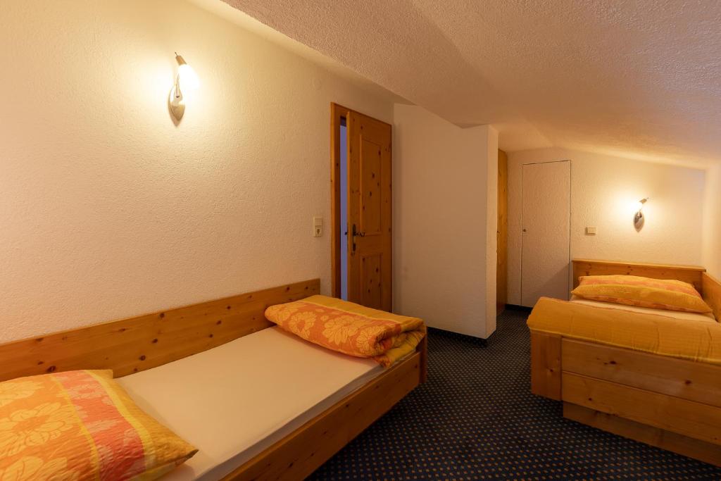 A bed or beds in a room at Haus Klaudia Gstrein