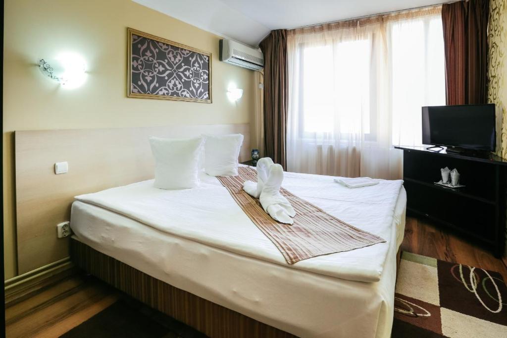 Postel nebo postele na pokoji v ubytování Vila Vidalis