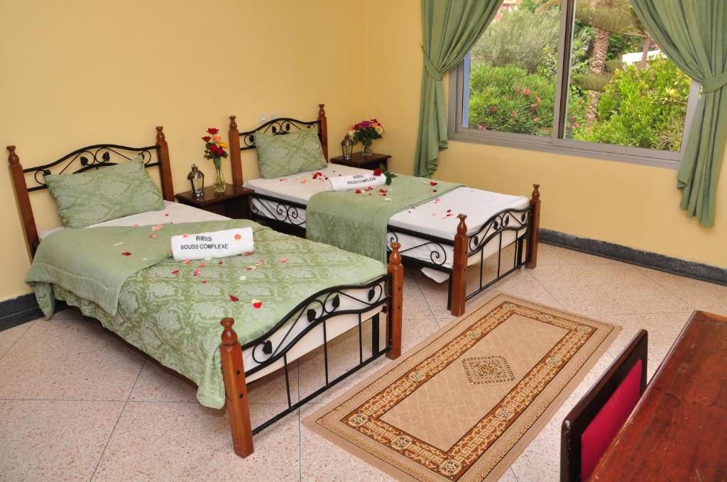 Postel nebo postele na pokoji v ubytování Hotel Ribis