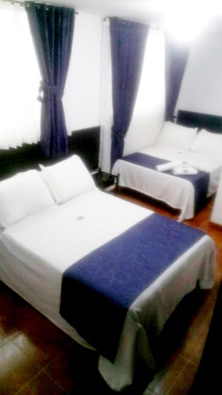 Postel nebo postele na pokoji v ubytování Hotel Casa Guillermo