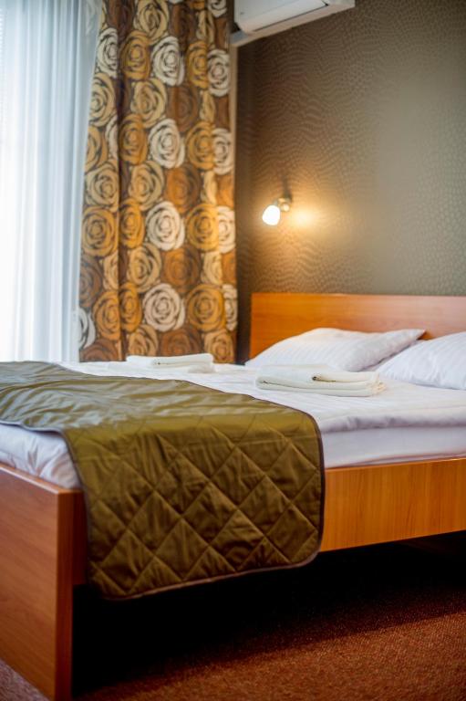 Postel nebo postele na pokoji v ubytování Wellness Hotel Thermal