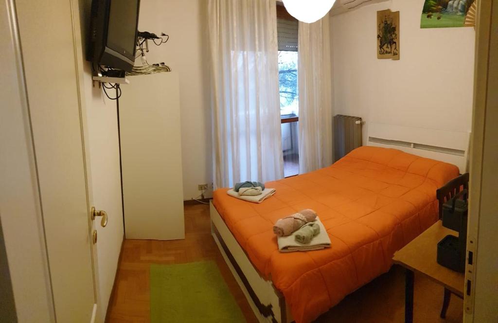 Ένα ή περισσότερα κρεβάτια σε δωμάτιο στο Civico 22 Pisa