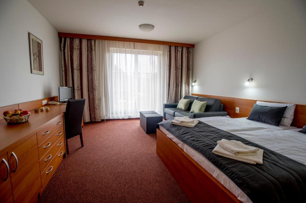 Postel nebo postele na pokoji v ubytování Wellness Hotel Thermal