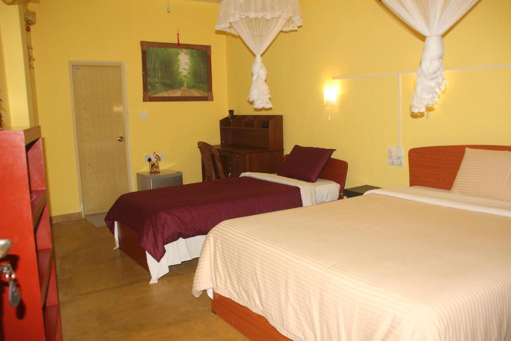 Postel nebo postele na pokoji v ubytování Welcome Inn