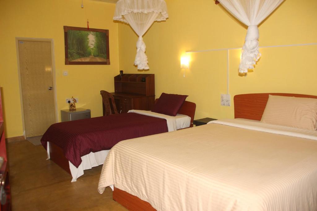 Postel nebo postele na pokoji v ubytování Welcome Inn