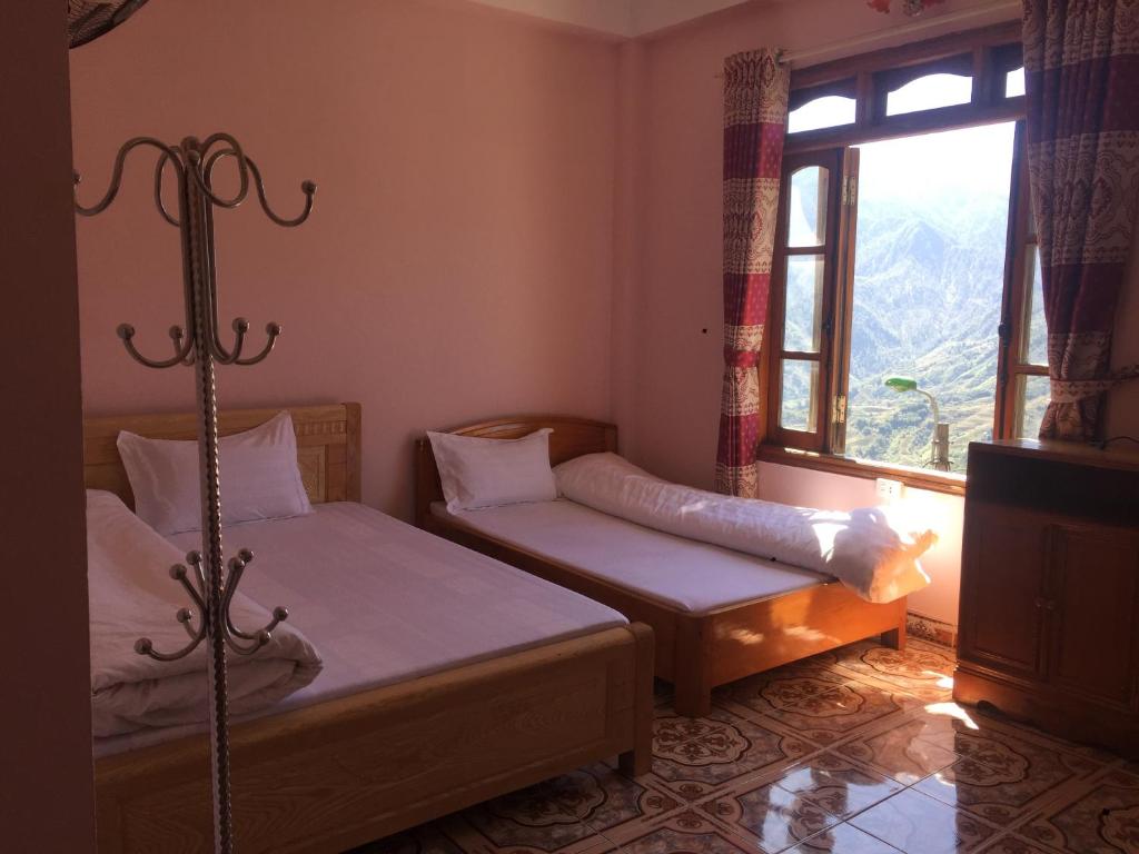 Postel nebo postele na pokoji v ubytování Viet Duc Guest House
