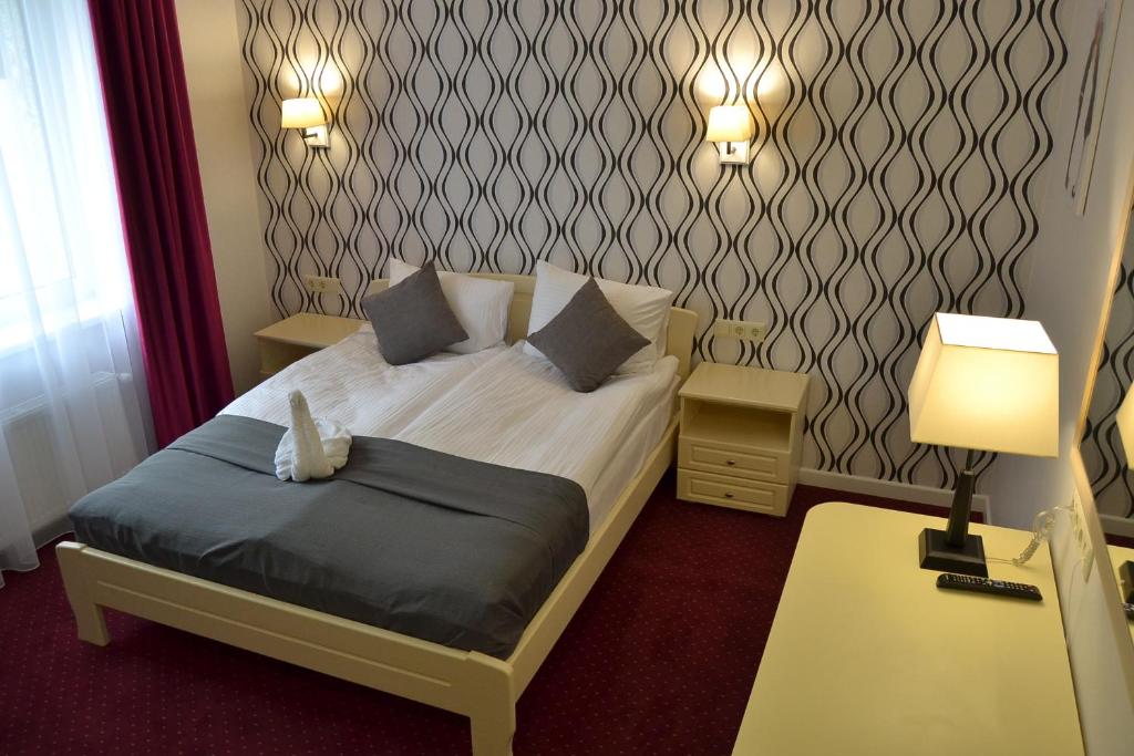 Postel nebo postele na pokoji v ubytování Hotel Ajur