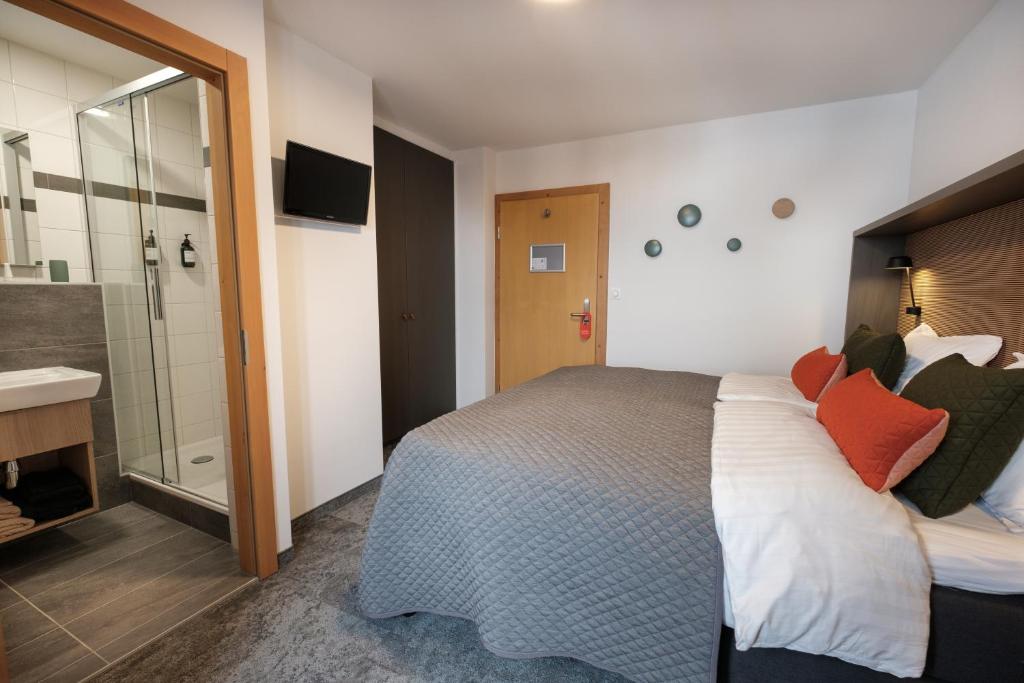 Postel nebo postele na pokoji v ubytování Hotel Les Etagnes