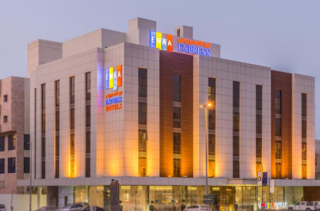 a large building with lights on top of it at Ewaa Express Hotel - Al Hamra in Jeddah