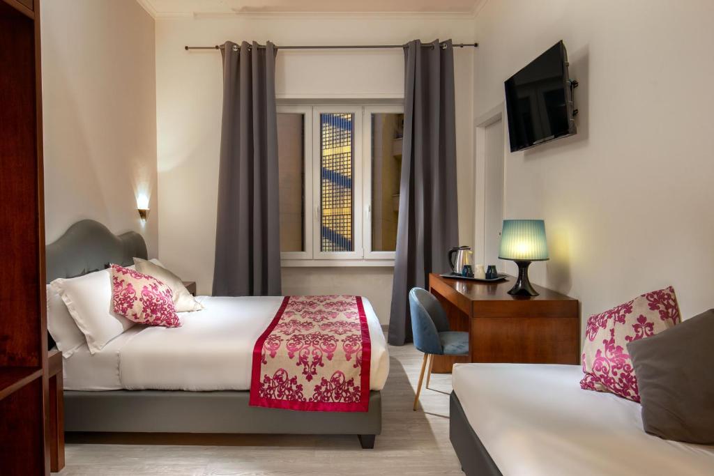 Posteľ alebo postele v izbe v ubytovaní Prima Guest House Collection