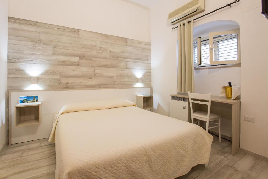 Postel nebo postele na pokoji v ubytování Albergo Labotte
