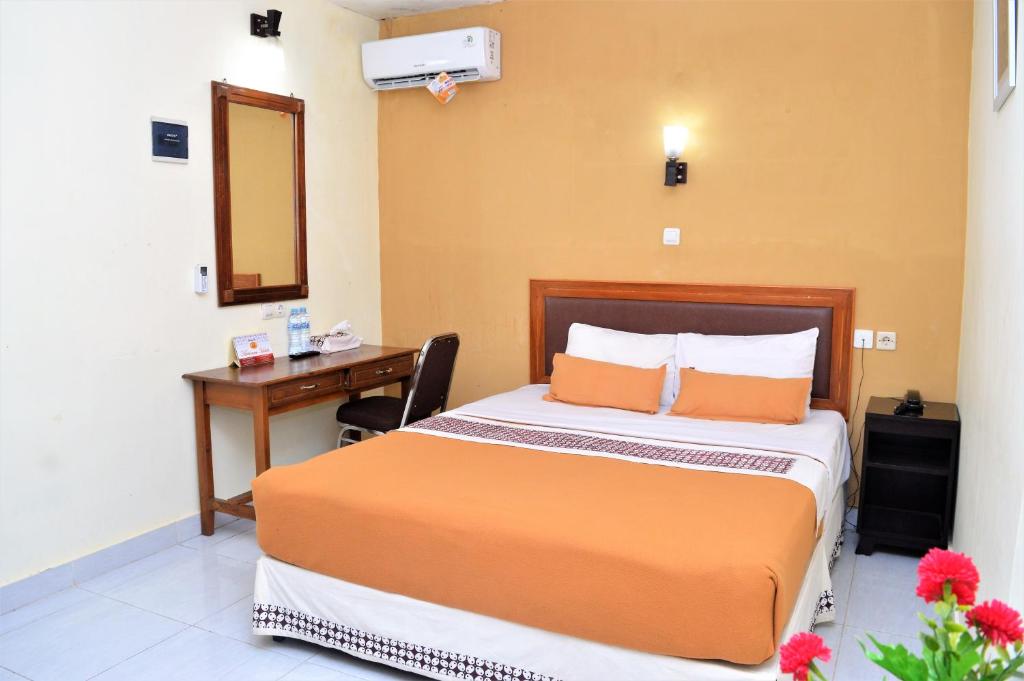 Postel nebo postele na pokoji v ubytování Hotel Mataram 2 Malioboro
