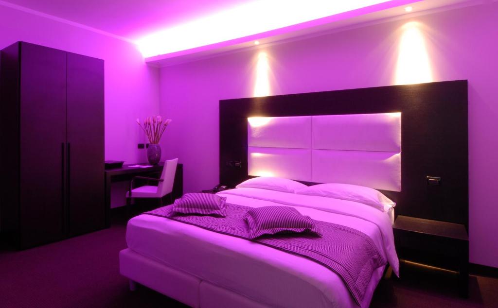 Postel nebo postele na pokoji v ubytování Hotel Villa Pannonia