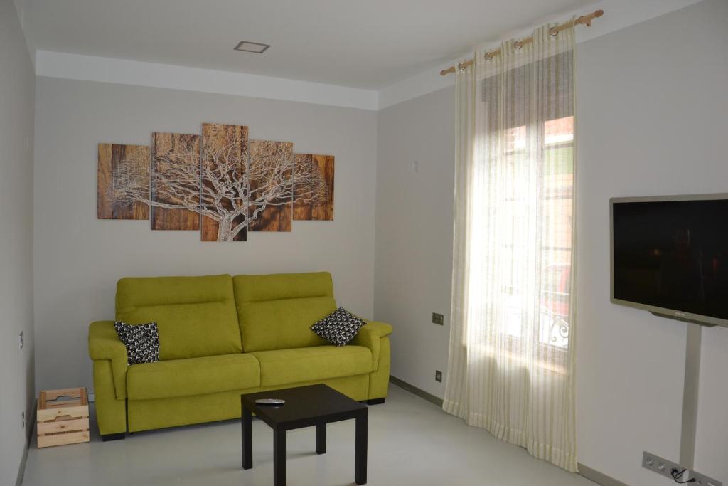 Televízia a/alebo spoločenská miestnosť v ubytovaní Apartamentos Mk77 León- San Isidoro