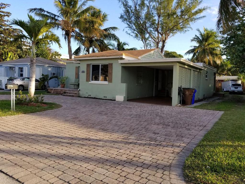 a house with a brick driveway in front of it at The Best location in Deerfield Beach. in Deerfield Beach