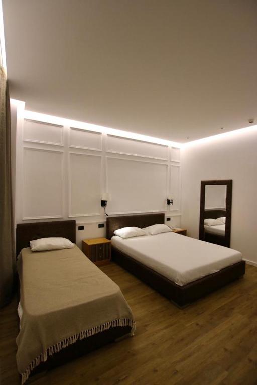 Cama o camas de una habitación en Aurelis Hotel