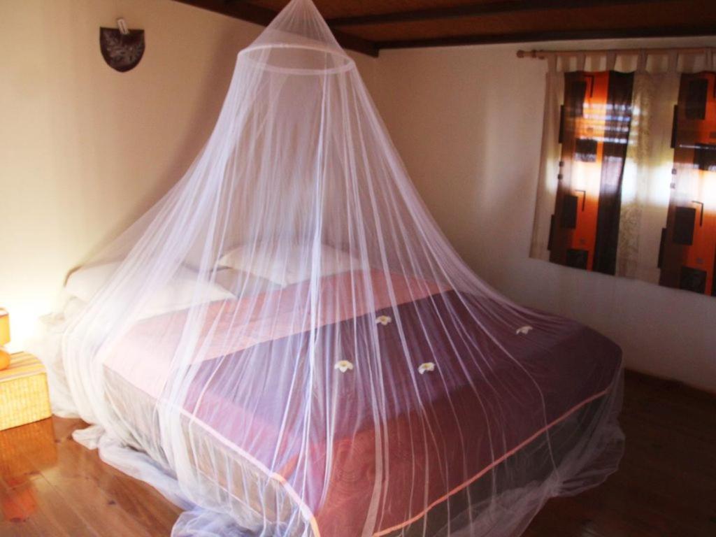 Postel nebo postele na pokoji v ubytování RESIDENCE LA TAUPINE MANDARINE