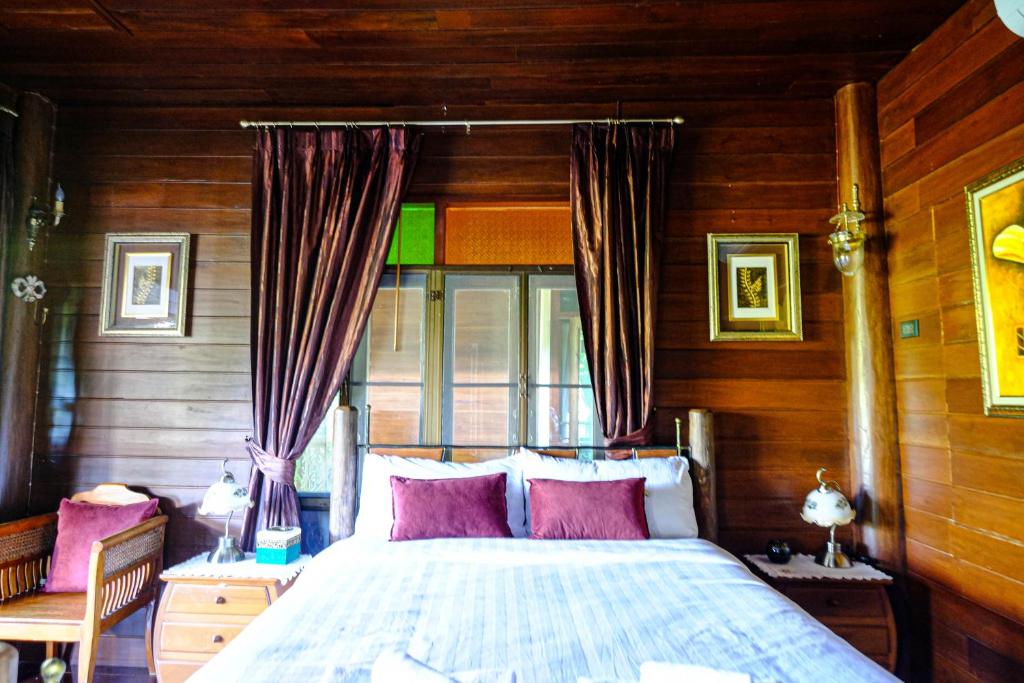 Postel nebo postele na pokoji v ubytování Rommai Villa Chiang Rai