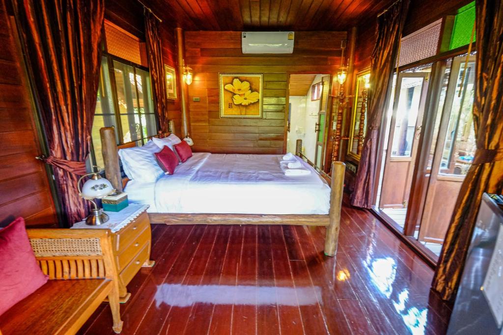 Postel nebo postele na pokoji v ubytování Rommai Villa Chiang Rai