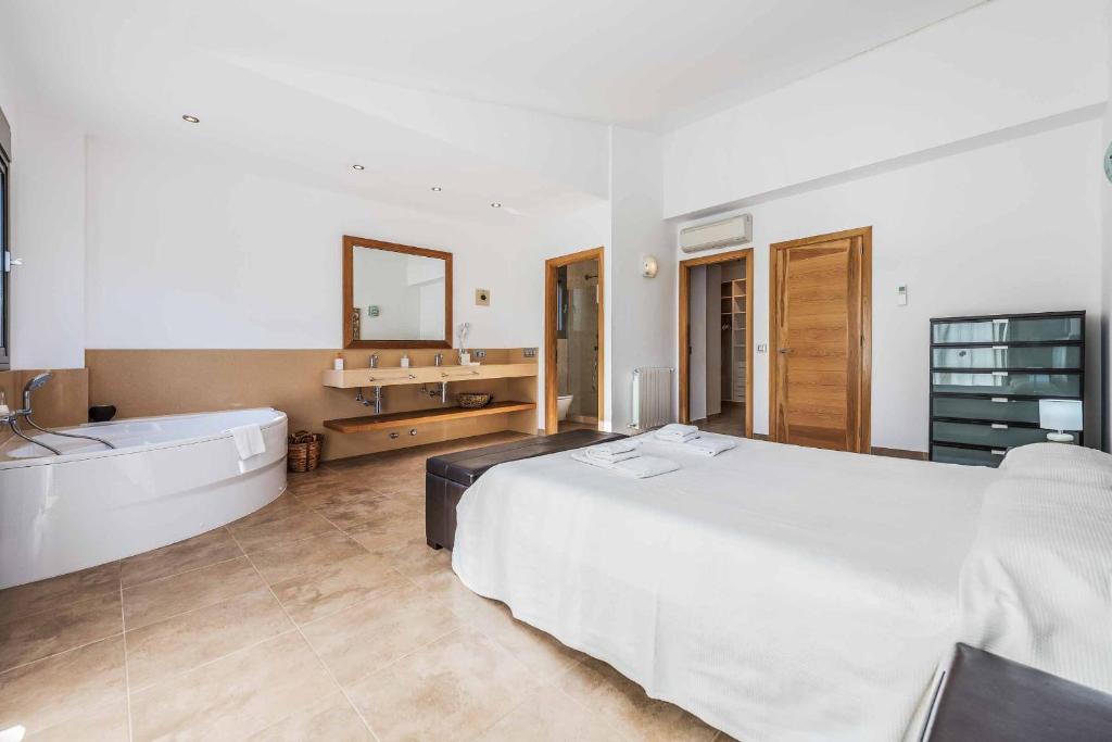 Postel nebo postele na pokoji v ubytování Villa Marioma