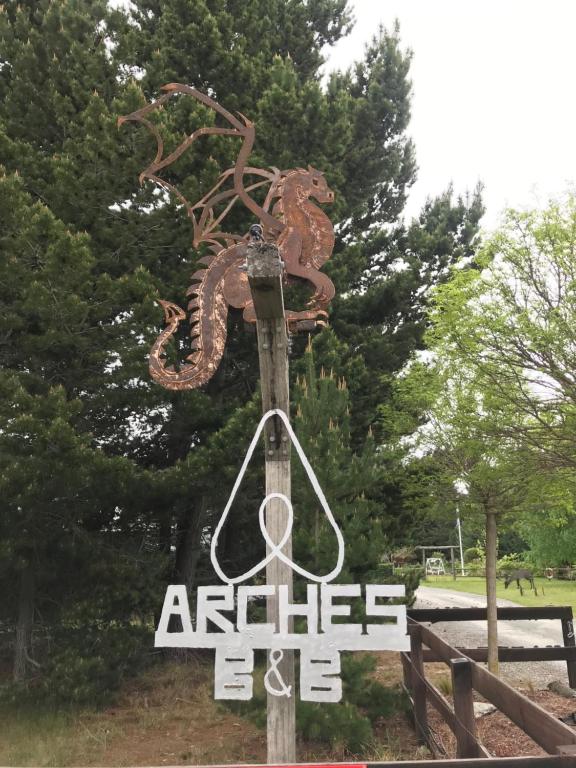 a sign that says antlers and a snakes sign at Arches in Twizel