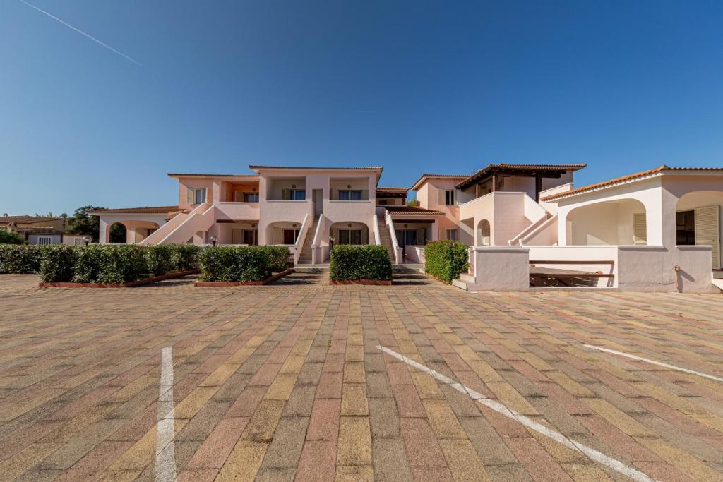 a group of houses in a parking lot at Residence Arcobaleno in San Teodoro