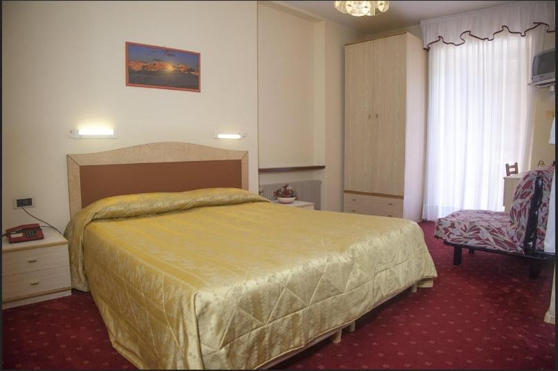 Postel nebo postele na pokoji v ubytování Hotel Venezia
