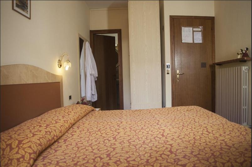 Postel nebo postele na pokoji v ubytování Hotel Venezia