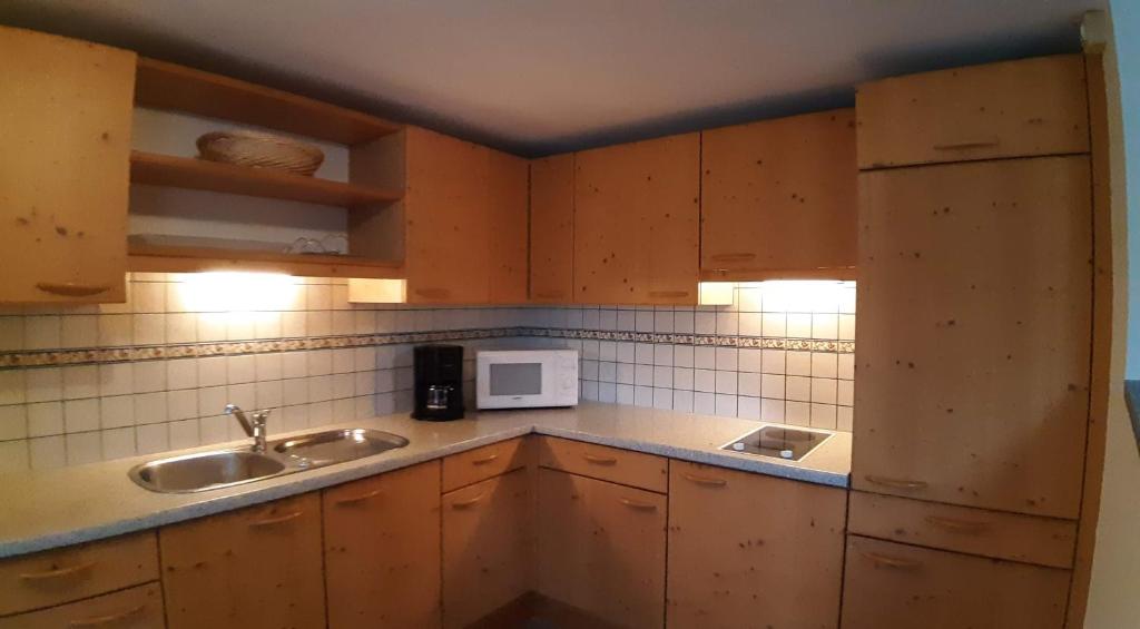 Kuchyň nebo kuchyňský kout v ubytování Appartements Königshofer