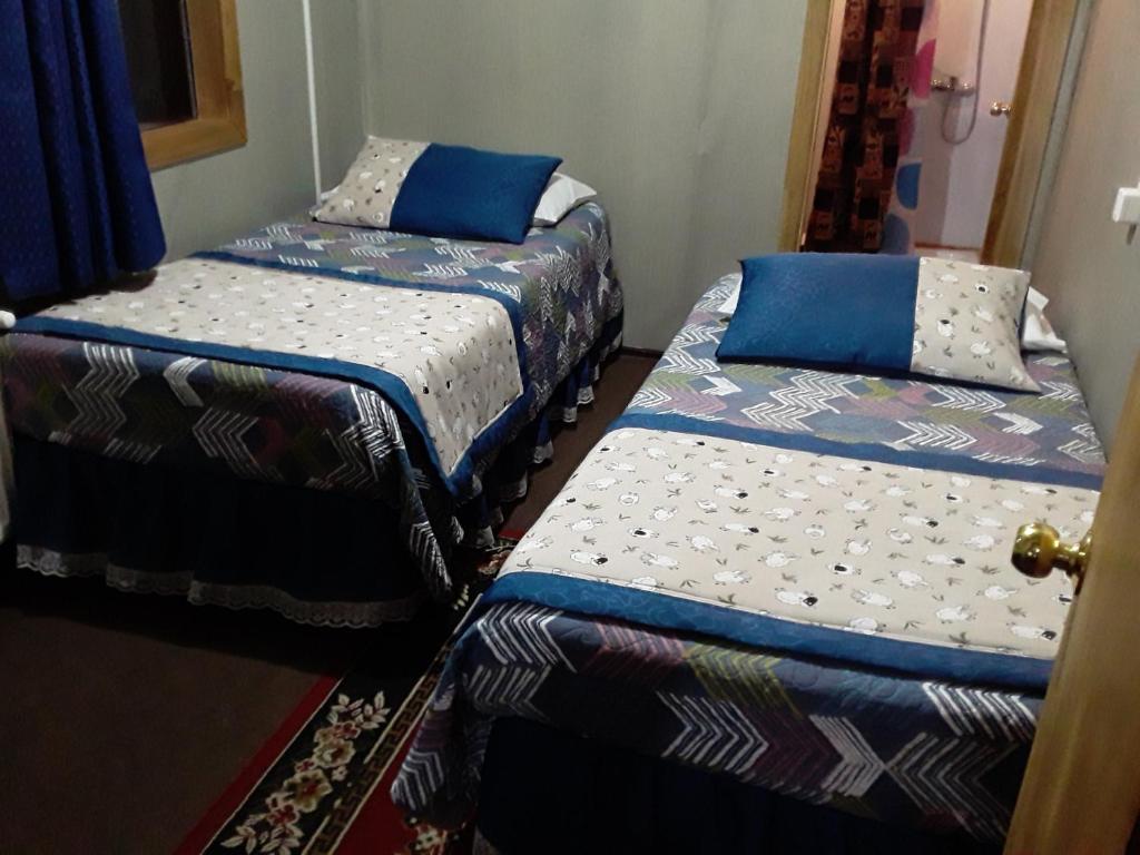 Postel nebo postele na pokoji v ubytování Hostal Don Pedro