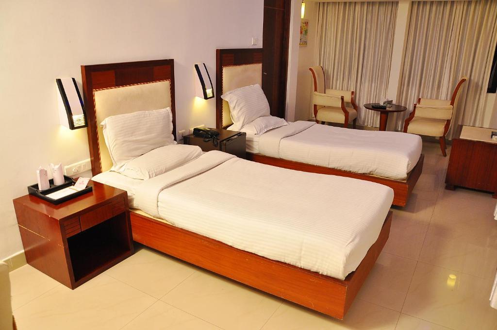 Postel nebo postele na pokoji v ubytování Hotel Luciya