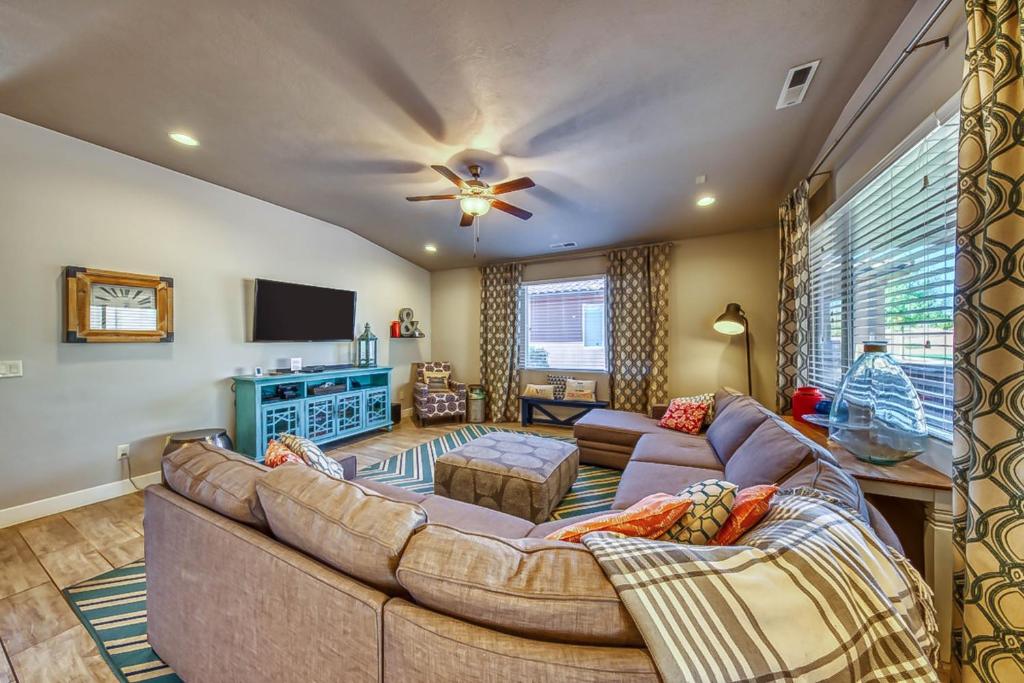 a living room with a couch and a tv at Splash Pad Place: Paradise Village #29 in Santa Clara