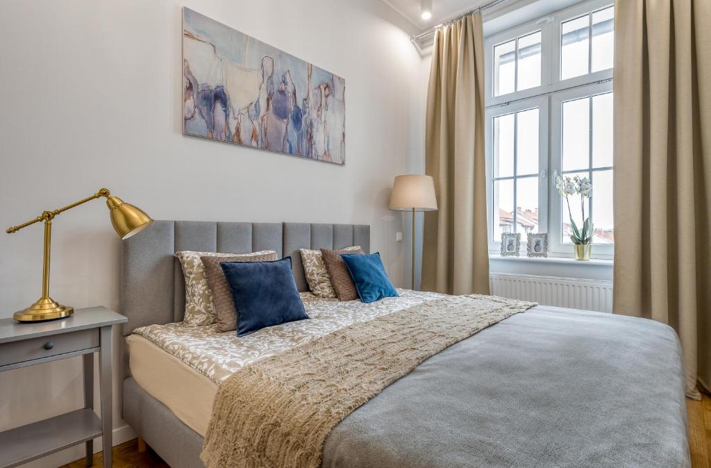 Posteľ alebo postele v izbe v ubytovaní Apartament Diamentowy