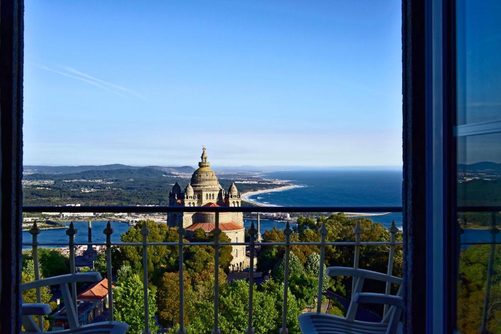 a view of a building from a window with chairs at Pousada de Viana do Castelo in Viana do Castelo