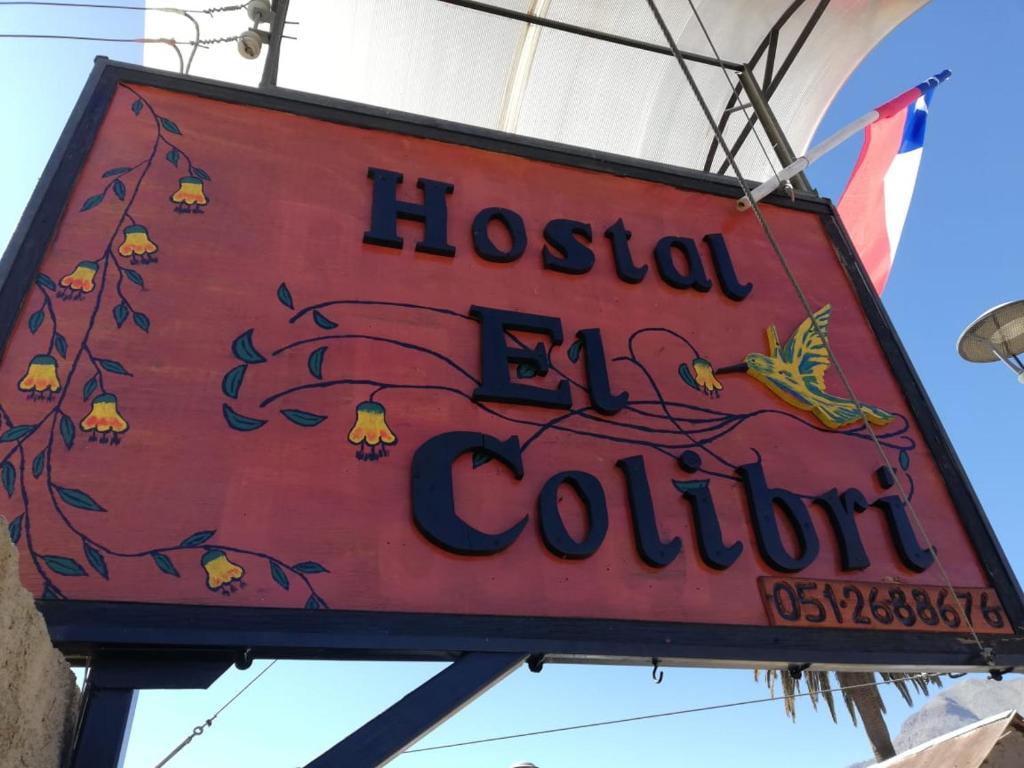 a sign for a hostel el equinoit at Hostal El Colibri in Vicuña