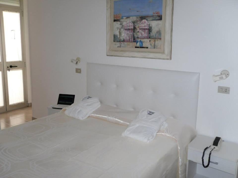 Postel nebo postele na pokoji v ubytování Hotel Diga