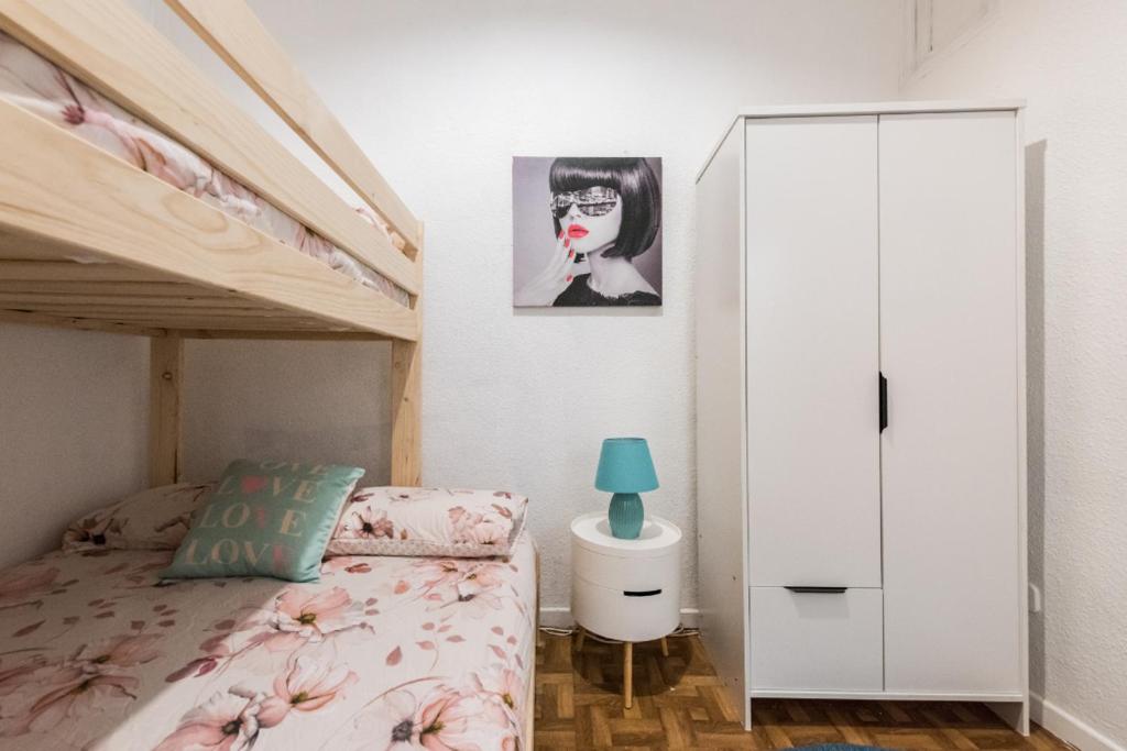 Postel nebo postele na pokoji v ubytování M&F Apartaments Chueca