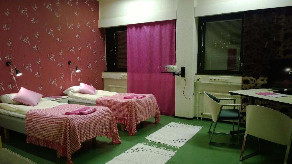 Postel nebo postele na pokoji v ubytování Motel Ruskalinna