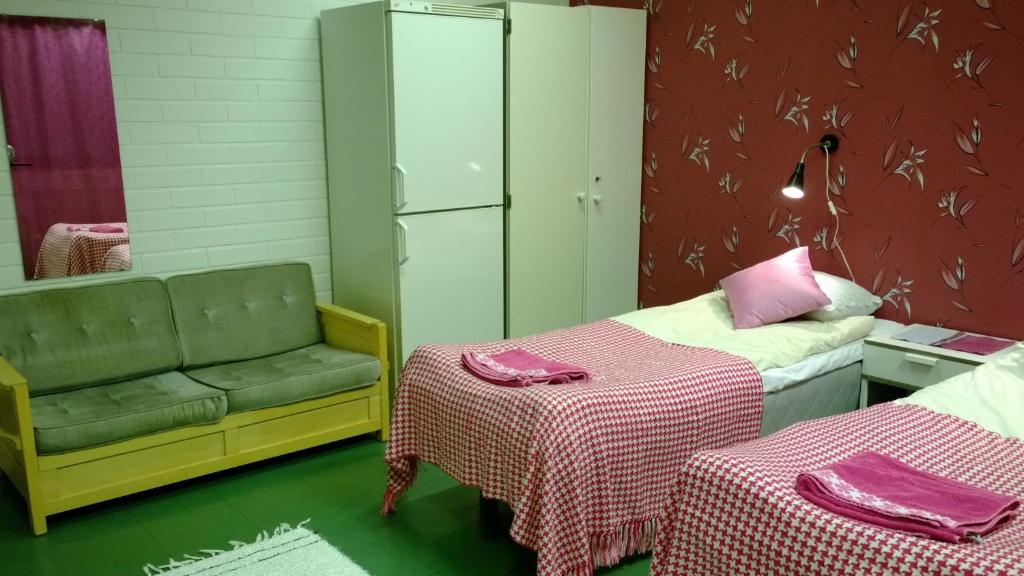 Postel nebo postele na pokoji v ubytování Motel Ruskalinna